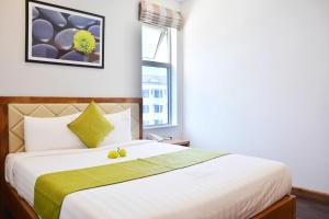 Postel nebo postele na pokoji v ubytování Richico Apartments And Hotel