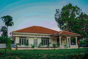 a white house with a red roof at The Chapters in Jaffna