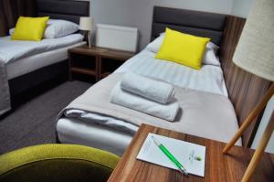 Postel nebo postele na pokoji v ubytování Hotel Klondaik Corner