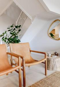 a room with two chairs and a table and a mirror at Pooch Friendly Renovated Beach Retreat with Views in Sunrise Beach