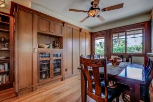 a dining room with a table and a ceiling fan at The Craftsman Coastal Cottage in Leucadia in Encinitas