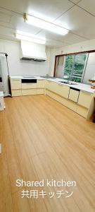 an empty room with a wooden floor in an office at Inn Komachiya - Vacation STAY 90943v in Senboku