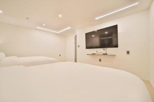Postel nebo postele na pokoji v ubytování Green B Hotel Busan Seomyeon