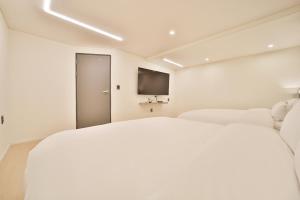Postel nebo postele na pokoji v ubytování Green B Hotel Busan Seomyeon