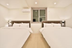 Postel nebo postele na pokoji v ubytování Green B Hotel Busan Seomyeon