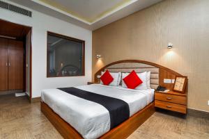Кровать или кровати в номере Hotel MSK Residency
