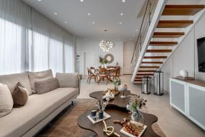 a living room with a couch and a table at New villa by the beach! in Boca del Soco