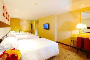 Voodi või voodid majutusasutuse Casa Real Hotel toas