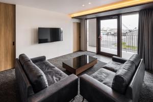 a living room with two couches and a tv at Hotel Dios - Vacation STAY 31184v in Awaji