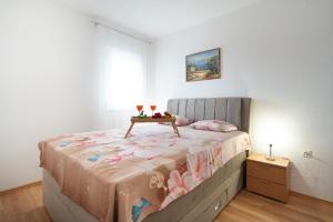 Postel nebo postele na pokoji v ubytování Apartments Milic
