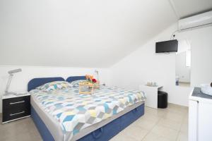 Postel nebo postele na pokoji v ubytování Apartments Milic
