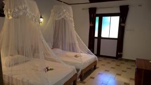 Postel nebo postele na pokoji v ubytování Etoile Labrine Guest House