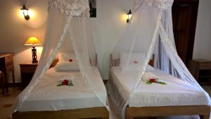 Postel nebo postele na pokoji v ubytování Etoile Labrine Guest House