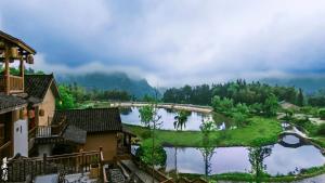 a view of a lake in a village at Dayong Antique Feature Resort in Zhangjiajie
