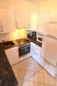 Kuchyň nebo kuchyňský kout v ubytování Goldene Ruh - App 205 - in unmittelbarer Strandlage mit Seeblickbalkon + 6 fotografií