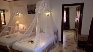 Postel nebo postele na pokoji v ubytování Etoile Labrine Guest House