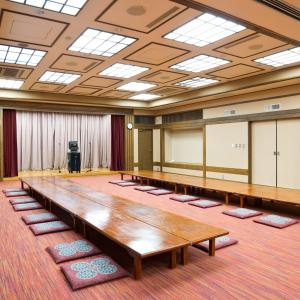 a large conference room with a large table in the middle at Asoviva Nagano Park in Nagano +33 photos