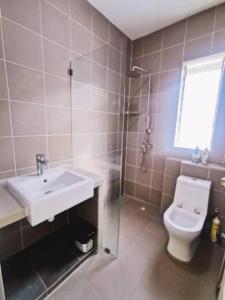 a bathroom with a toilet and a sink and a shower at 90 Home4Stay 2storeySemi-D gurney&beach Shopping local food in Tanjung Bungah +16 photos