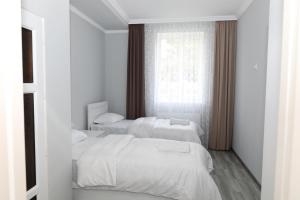 Rúm í herbergi á VST KHANOYAN'S HOTEL