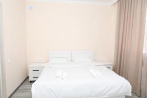 Rúm í herbergi á VST KHANOYAN'S HOTEL