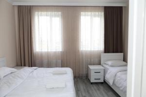 Rúm í herbergi á VST KHANOYAN'S HOTEL