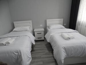 Rúm í herbergi á VST KHANOYAN'S HOTEL