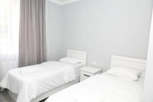 Rúm í herbergi á VST KHANOYAN'S HOTEL