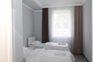 Rúm í herbergi á VST KHANOYAN'S HOTEL