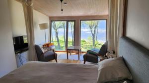 Postel nebo postele na pokoji v ubytování Guest House Vidlauči