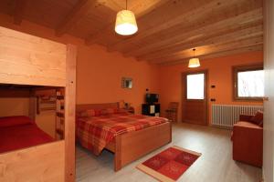 Postel nebo postele na pokoji v ubytování Agriturismo Val Codera