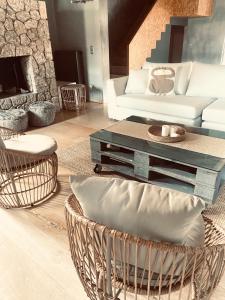 a living room with a couch and a coffee table at Le Blanc in Dassia