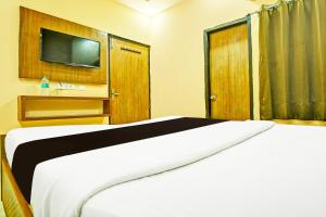 Katil atau katil-katil dalam bilik di OYO Hotel Poras