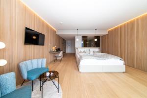 Postel nebo postele na pokoji v ubytování Apollo AchtQuartier Das Hotel am Mondsee