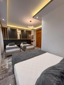 a bedroom with two beds in a room at Rain Hotel in Kizkalesi