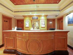 a large bar in a room with at City Plaza Hotel in Fujairah