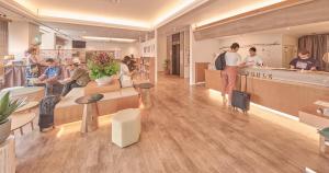 a rendering of a restaurant with people waiting at the counter at Ishigakijima Hotel Cucule in Ishigaki Island
