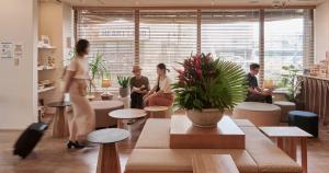 a group of people sitting in a room at Ishigakijima Hotel Cucule in Ishigaki Island