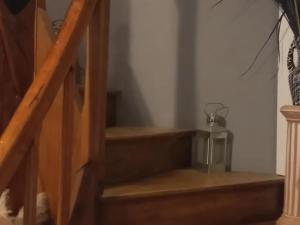 a set of stairs in a room with a candle at Le Relais De Rochepaule in Rochepaule