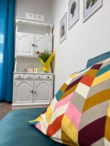 Ένα ή περισσότερα κρεβάτια σε δωμάτιο στο La Casina Azzurra