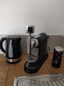 a coffee maker sitting on top of a counter at Le Palais du Tropique in Juan-les-Pins