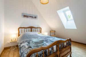 Ένα ή περισσότερα κρεβάτια σε δωμάτιο στο Maison Ty Mel à 3 km des plages