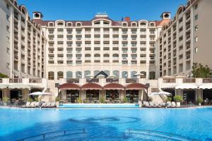 a large hotel with a large pool in front of it at Melia Grand Hermitage All Inclusive in Golden Sands