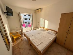 Postelja oz. postelje v sobi nastanitve Apartmani Vukcevic