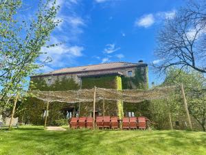 a group of chairs in front of a building at L'ancien Relais de Poste*** in Saint-Dier-dʼAuvergne