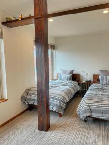 a room with two beds in a room at Populus-club Otaru - Vacation STAY 93434v in Otaru