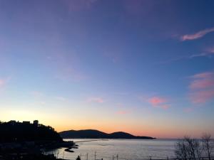 a view of the ocean at sunset at Populus-club Otaru - Vacation STAY 93434v in Otaru