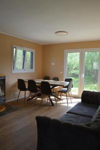 a dining room with a table and chairs at Agroturystyka Dzikie Stawy-Mazury in Golubie Wężewskie