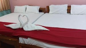 A bed or beds in a room at sudhara Residecy
