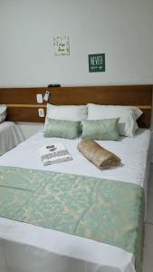 Ένα ή περισσότερα κρεβάτια σε δωμάτιο στο HOTEL BEIRA RIO