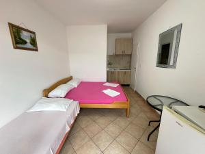 Postelja oz. postelje v sobi nastanitve Apartmani Vukcevic